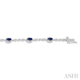 5x3 MM Oval Cut Sapphire and 1/20 Ctw Round Cut Diamond Bracelet in 14K White Gold