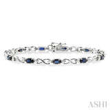 5x3 MM Oval Cut Sapphire and 1/10 Ctw Single Cut Diamond Bracelet in 10K White Gold